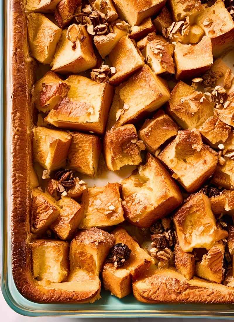 Overhead shot of french toast casserole in a baking dish – a simple, natural image showing golden brown,